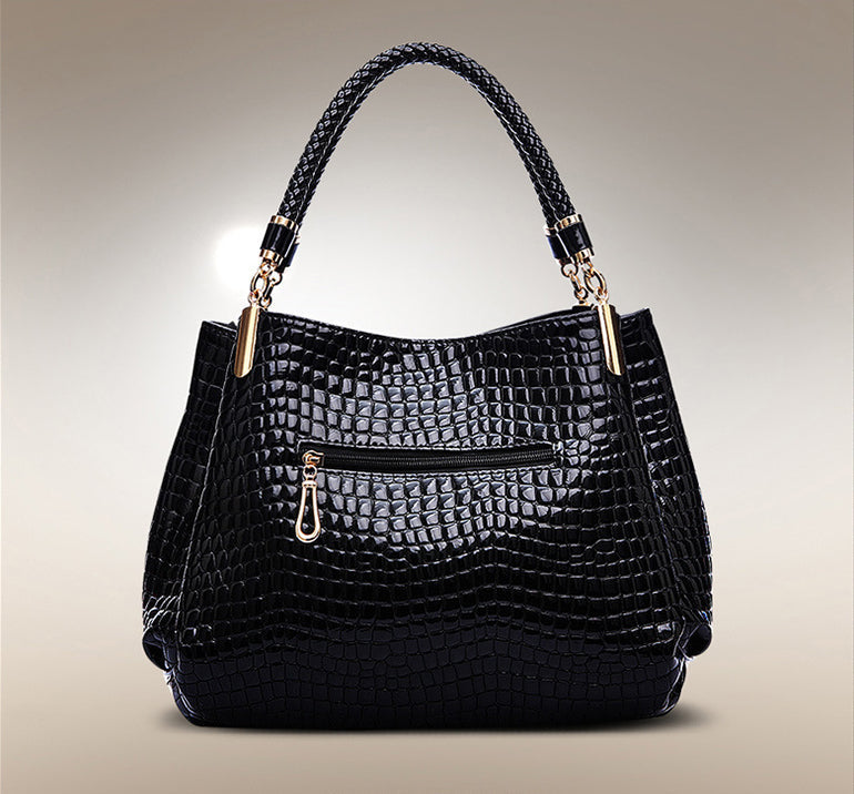 Xella | Elegante bolso con motivo de cocodrilo.
